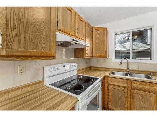 79 Taraglen Road Ne, Calgary, AB - Indoor Photo Showing Kitchen With Double Sink