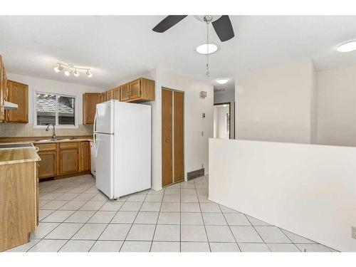 79 Taraglen Road Ne, Calgary, AB - Indoor Photo Showing Kitchen With Double Sink