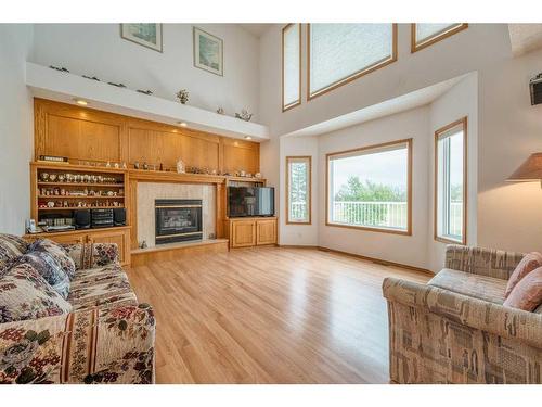 16 Hamptons Heath Nw, Calgary, AB - Indoor Photo Showing Living Room With Fireplace