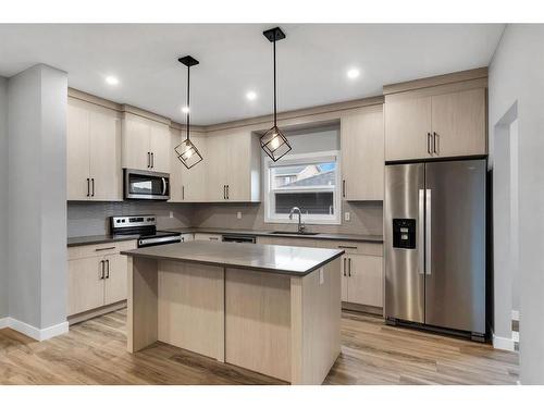 105 Midtown Close Sw, Airdrie, AB - Indoor Photo Showing Kitchen With Stainless Steel Kitchen With Upgraded Kitchen