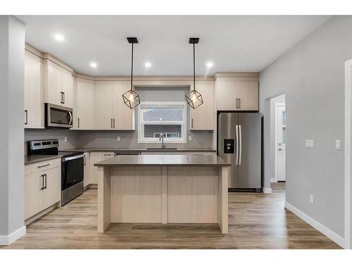 105 Midtown Close Sw, Airdrie, AB - Indoor Photo Showing Kitchen With Stainless Steel Kitchen With Upgraded Kitchen