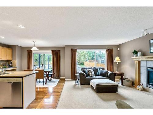 168 Bridlepost Green Sw, Calgary, AB - Indoor With Fireplace