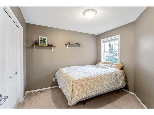 168 Bridlepost Green Sw, Calgary, AB - Indoor Photo Showing Bedroom