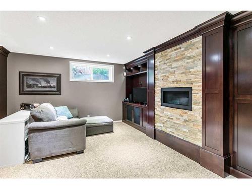 168 Bridlepost Green Sw, Calgary, AB - Indoor With Fireplace