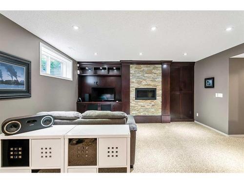 168 Bridlepost Green Sw, Calgary, AB - Indoor With Fireplace