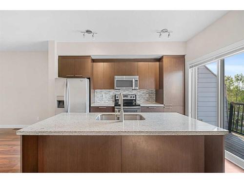 355 Silverado Common Sw, Calgary, AB - Indoor Photo Showing Kitchen With Double Sink With Upgraded Kitchen