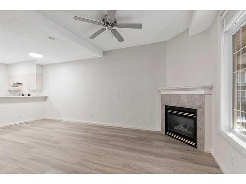 217-527 15 Avenue Sw, Calgary, AB - Indoor Photo Showing Living Room With Fireplace