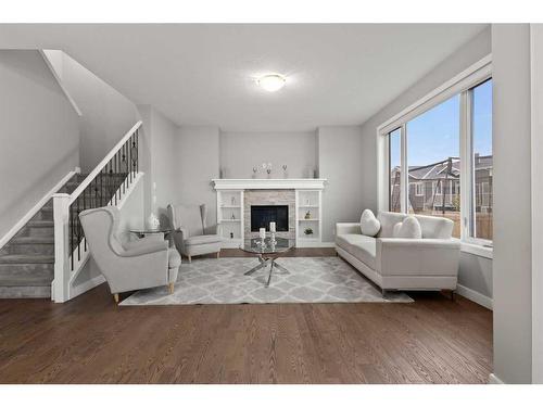 566 Silverado Boulevard Sw, Calgary, AB - Indoor Photo Showing Living Room With Fireplace