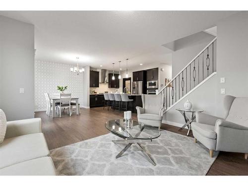 566 Silverado Boulevard Sw, Calgary, AB - Indoor Photo Showing Living Room