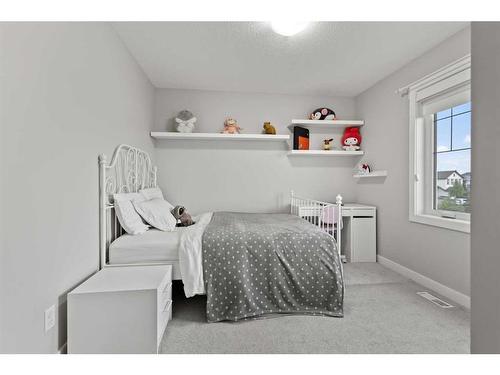 566 Silverado Boulevard Sw, Calgary, AB - Indoor Photo Showing Bedroom