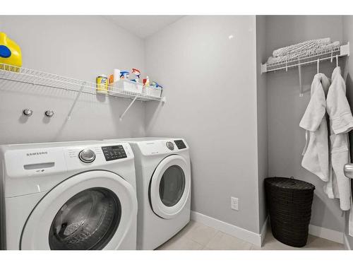 566 Silverado Boulevard Sw, Calgary, AB - Indoor Photo Showing Laundry Room