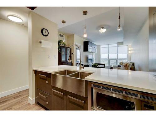 203-10 Shawnee Hill Sw, Calgary, AB - Indoor Photo Showing Kitchen With Double Sink