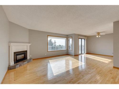 104 Norquay Heights Nw, Calgary, AB - Indoor With Fireplace