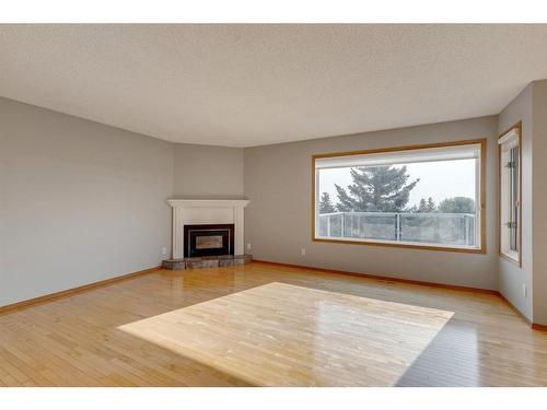 104 Norquay Heights Nw, Calgary, AB - Indoor Photo Showing Living Room With Fireplace