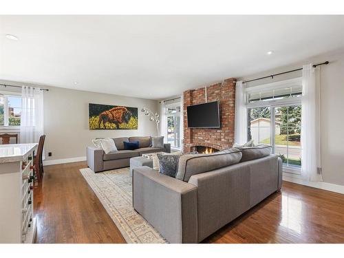 1023 Lake Bonavista Drive Se, Calgary, AB - Indoor Photo Showing Living Room With Fireplace