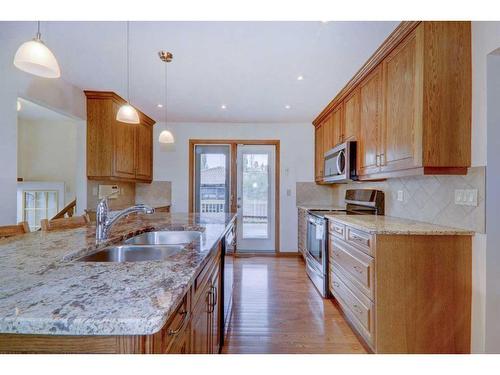 223 Silvercreek Drive Nw, Calgary, AB - Indoor Photo Showing Kitchen With Double Sink