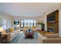 223 Silvercreek Drive Nw, Calgary, AB  - Indoor Photo Showing Living Room With Fireplace 