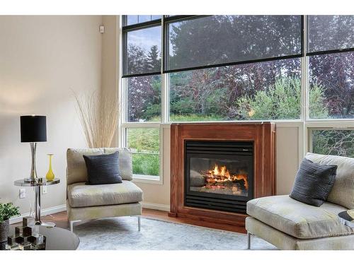 4613 Hamptons Way Nw, Calgary, AB - Indoor Photo Showing Living Room With Fireplace