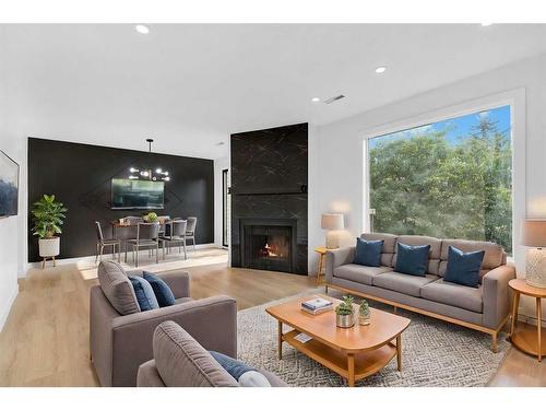 11-2519 38 Street Ne, Calgary, AB - Indoor Photo Showing Living Room With Fireplace