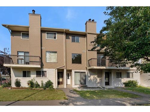 11-2519 38 Street Ne, Calgary, AB - Outdoor With Balcony With Deck Patio Veranda With Facade