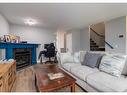 137 Everglen Grove Sw, Calgary, AB  - Indoor Photo Showing Living Room With Fireplace 