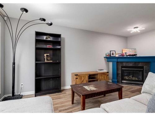 137 Everglen Grove Sw, Calgary, AB - Indoor Photo Showing Living Room With Fireplace