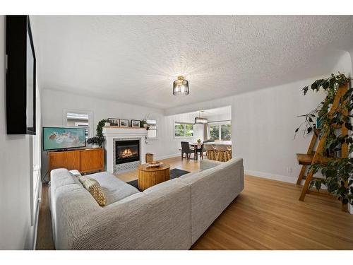 1725 28 Street Sw, Calgary, AB - Indoor Photo Showing Living Room With Fireplace