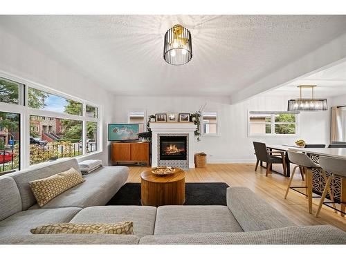 1725 28 Street Sw, Calgary, AB - Indoor Photo Showing Living Room With Fireplace