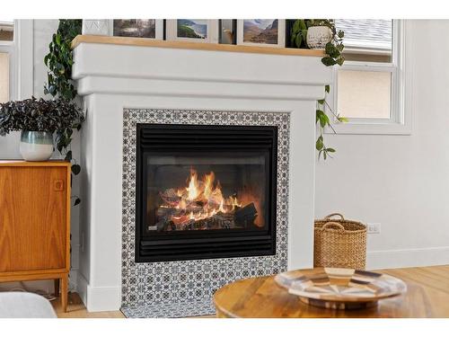 1725 28 Street Sw, Calgary, AB - Indoor Photo Showing Living Room With Fireplace