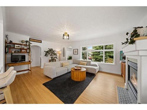 1725 28 Street Sw, Calgary, AB - Indoor Photo Showing Living Room With Fireplace