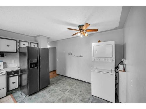 215 Rundlecairn Road Ne, Calgary, AB - Indoor Photo Showing Laundry Room