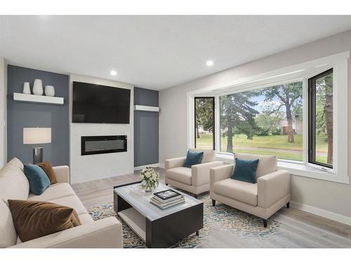 3252 33A Avenue Se, Calgary, AB - Indoor Photo Showing Living Room With Fireplace