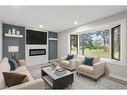 3252 33A Avenue Se, Calgary, AB  - Indoor Photo Showing Living Room With Fireplace 