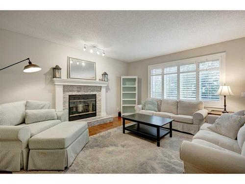 11 Douglas Woods Hill Se, Calgary, AB - Indoor Photo Showing Living Room With Fireplace