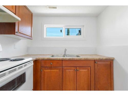 224 Penswood Way Se, Calgary, AB - Indoor Photo Showing Kitchen With Double Sink