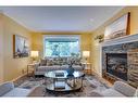 820 15 Street Nw, Calgary, AB  - Indoor Photo Showing Living Room With Fireplace 