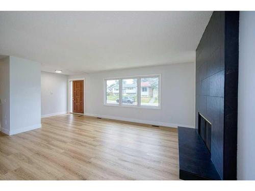 115 Pineside Place Ne, Calgary, AB - Indoor With Fireplace