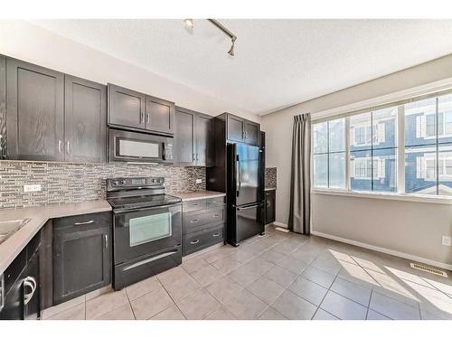 2316-125 Panatella Way Nw, Calgary, AB - Indoor Photo Showing Kitchen With Double Sink With Upgraded Kitchen