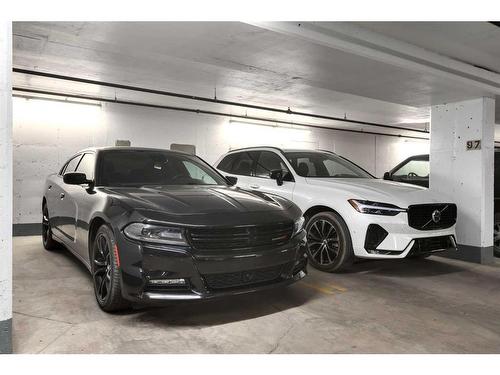 1704-400 Eau Claire Avenue Sw, Calgary, AB - Indoor Photo Showing Garage