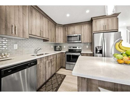 116 Yorkville Avenue Sw, Calgary, AB - Indoor Photo Showing Kitchen With Stainless Steel Kitchen With Double Sink With Upgraded Kitchen