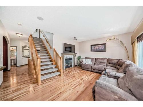 30 Everhollow Rise Sw, Calgary, AB - Indoor Photo Showing Living Room With Fireplace