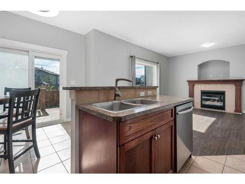 793 Luxstone Landing Sw, Airdrie, AB - Indoor With Fireplace