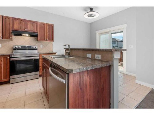 793 Luxstone Landing Sw, Airdrie, AB - Indoor Photo Showing Kitchen With Double Sink