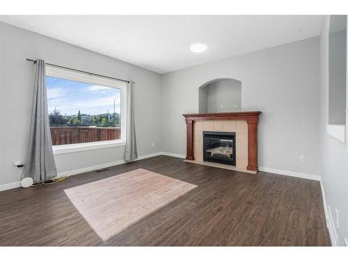 793 Luxstone Landing Sw, Airdrie, AB - Indoor Photo Showing Living Room With Fireplace