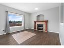 793 Luxstone Landing Sw, Airdrie, AB  - Indoor Photo Showing Living Room With Fireplace 