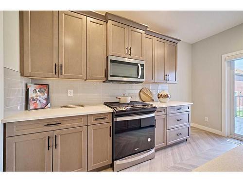 48 Shawnee Green Sw, Calgary, AB - Indoor Photo Showing Kitchen