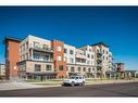 504-71 Shawnee Common Sw, Calgary, AB  - Outdoor With Facade 