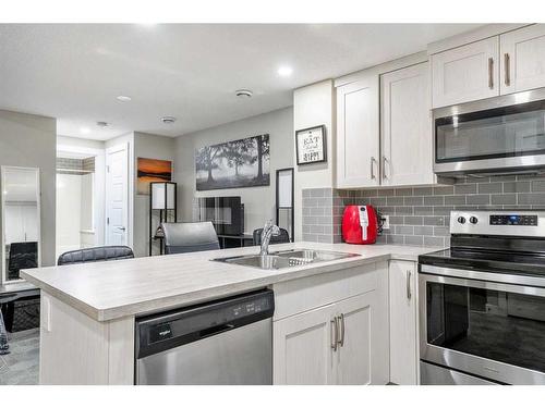 90 Seton Grove Se, Calgary, AB - Indoor Photo Showing Kitchen With Stainless Steel Kitchen With Double Sink