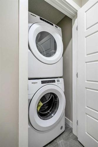 90 Seton Grove Se, Calgary, AB - Indoor Photo Showing Laundry Room