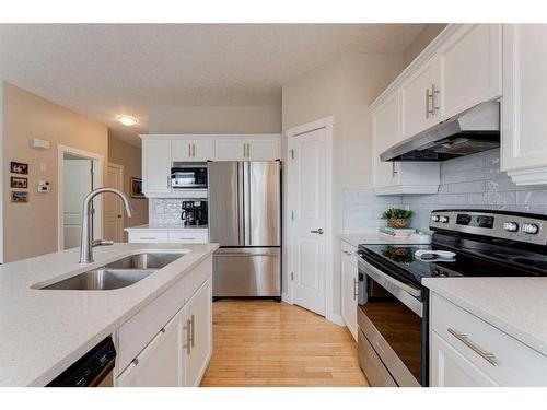 193 Rockyspring Grove Nw, Calgary, AB - Indoor Photo Showing Kitchen With Stainless Steel Kitchen With Double Sink With Upgraded Kitchen